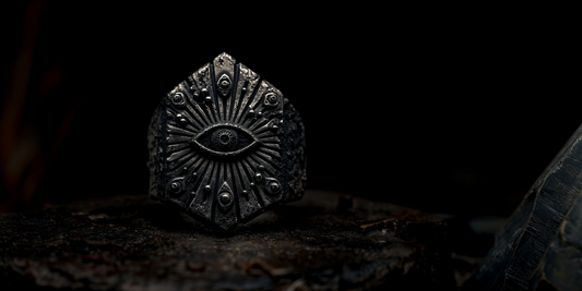 a ring with the eye of providence and multiple eyes bursting out of it