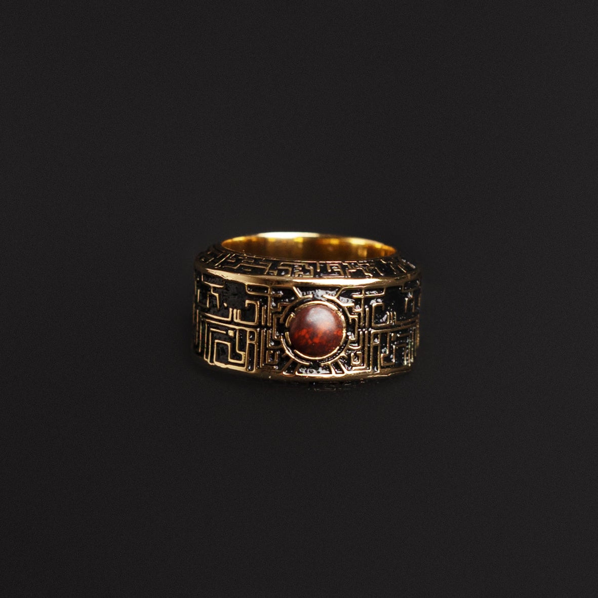 Geometric ring with sci-fi motifs and semiprecious stone