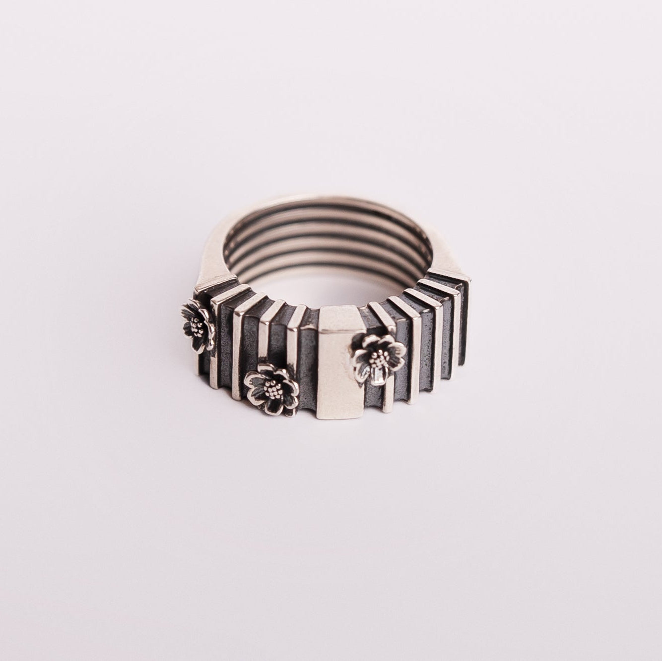 oxidised silver ring with floral motifs