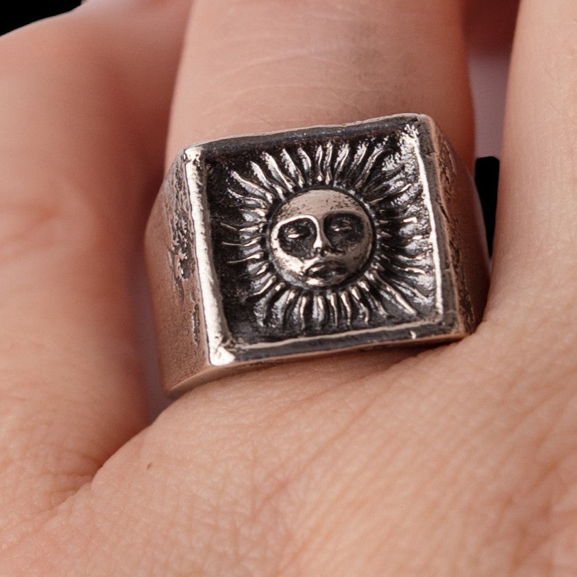symbolic philosophy ring with sun face