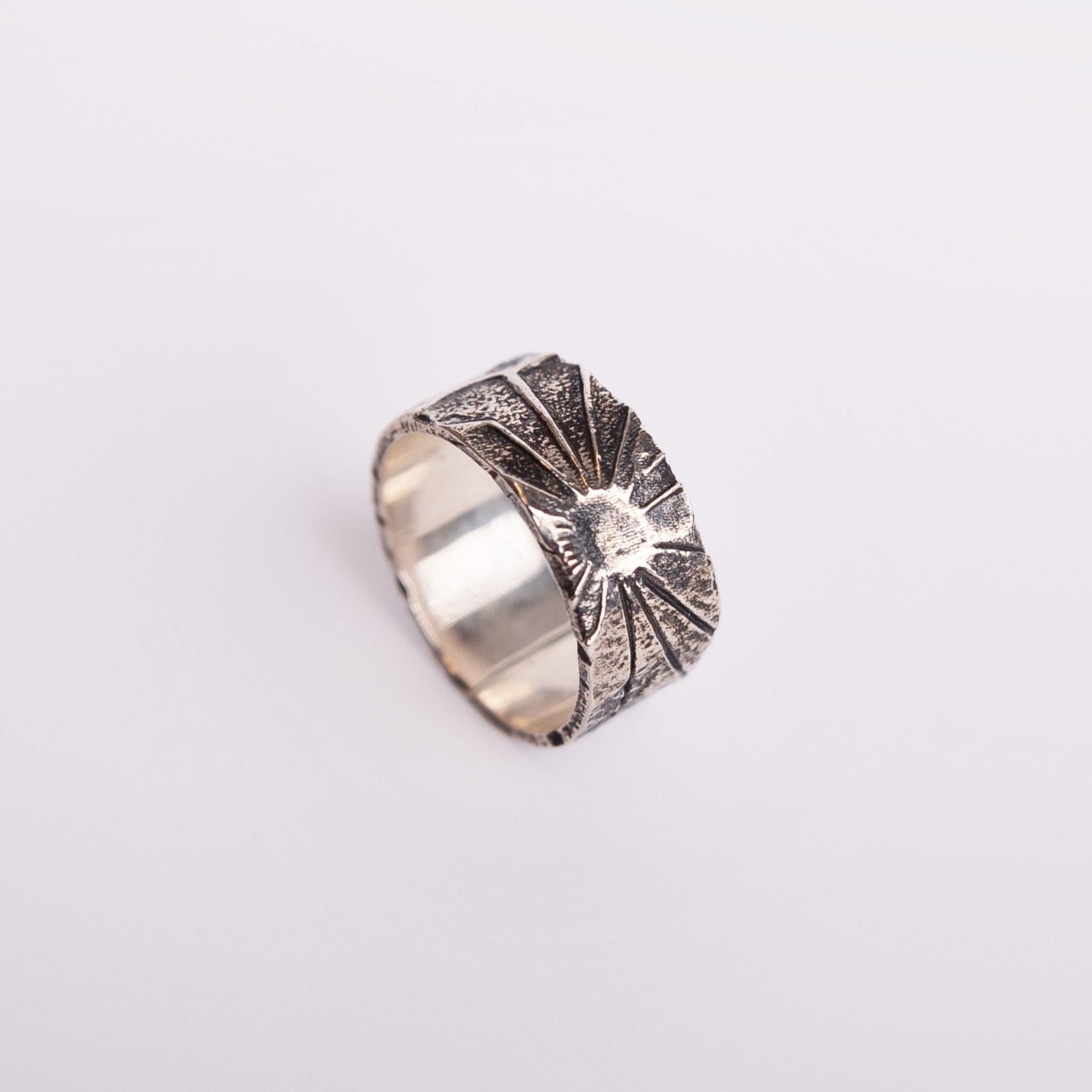 black sunburst ring