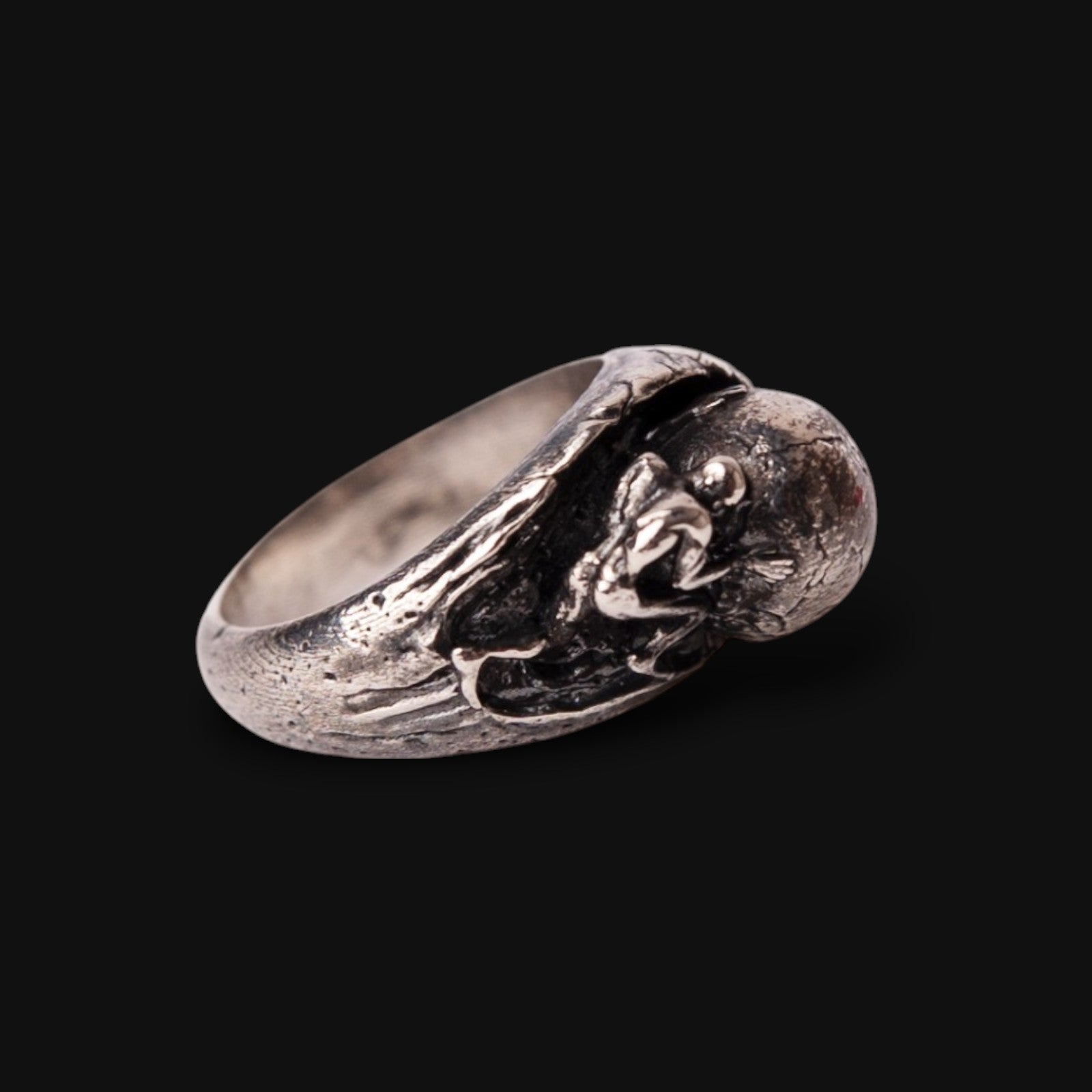 man pushing the stone ring