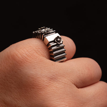 artistic statement ring on a finger
