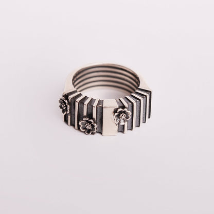 oxidised silver ring with floral motifs